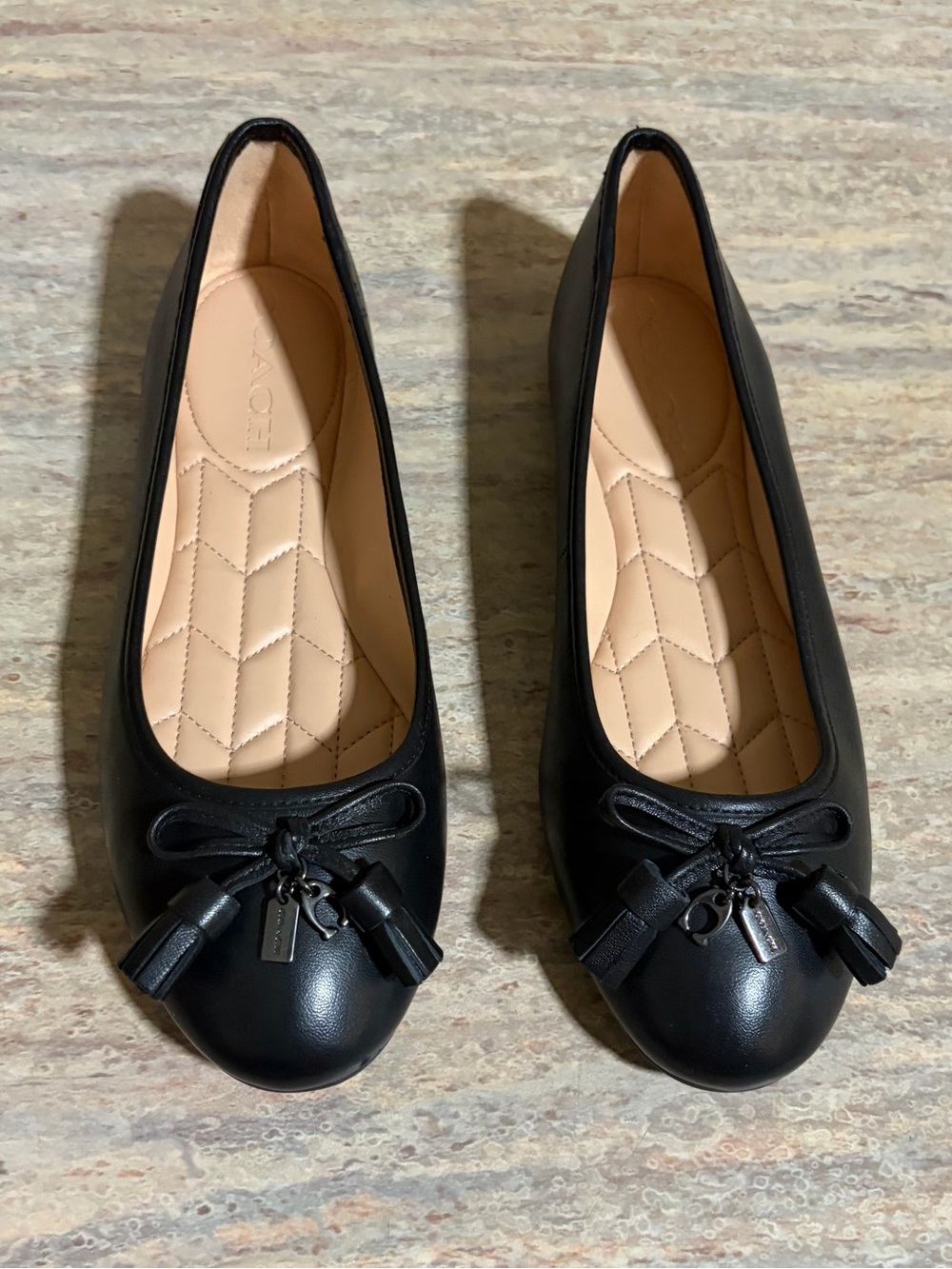 Coach Benni Women’s Black Leather Ballet Flats with Tassel Accent
